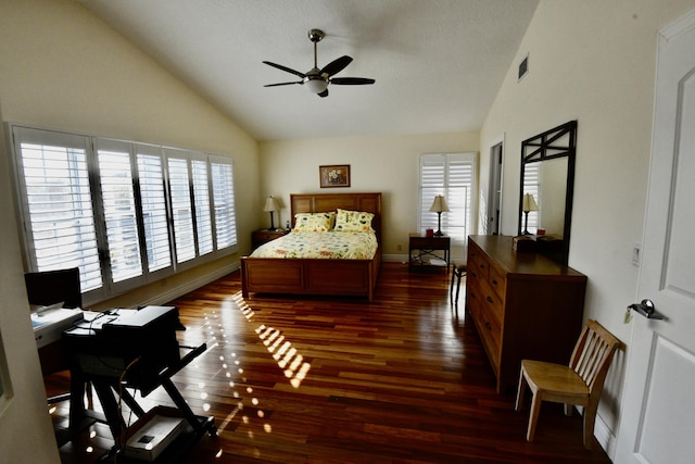 bedroom with dark hardwood / wood-style floors, ceiling fan, and high vaulted ceiling