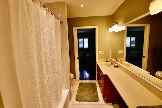 bathroom with tile patterned flooring, vanity, toilet, and a shower with curtain