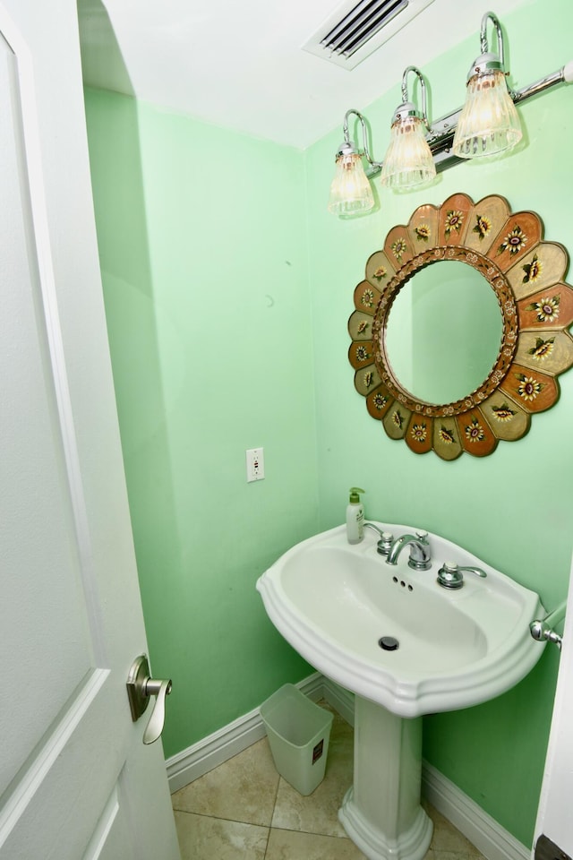 bathroom with tile patterned floors