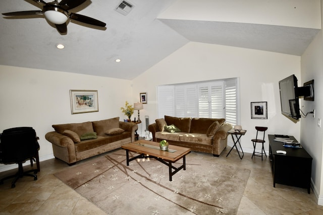 living room with ceiling fan, light tile patterned flooring, and lofted ceiling