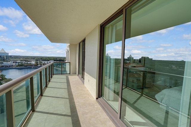 balcony featuring a water view