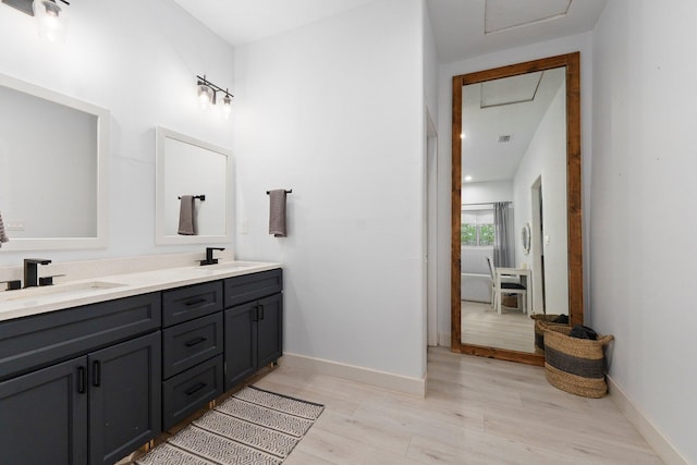 bathroom featuring hardwood / wood-style floors and vanity