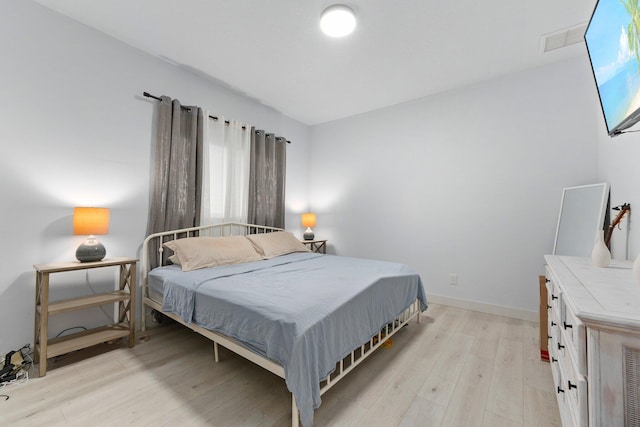 bedroom featuring light wood-type flooring