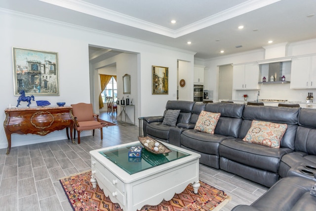 living room featuring light wood-type flooring and crown molding