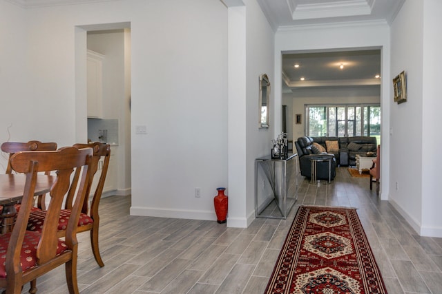 hall featuring light hardwood / wood-style floors and ornamental molding