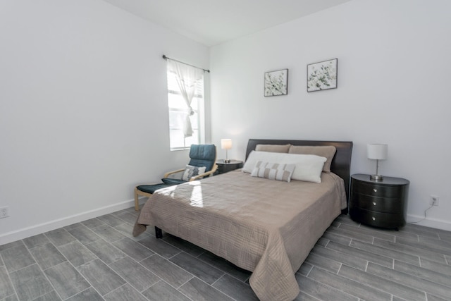 bedroom with wood-type flooring