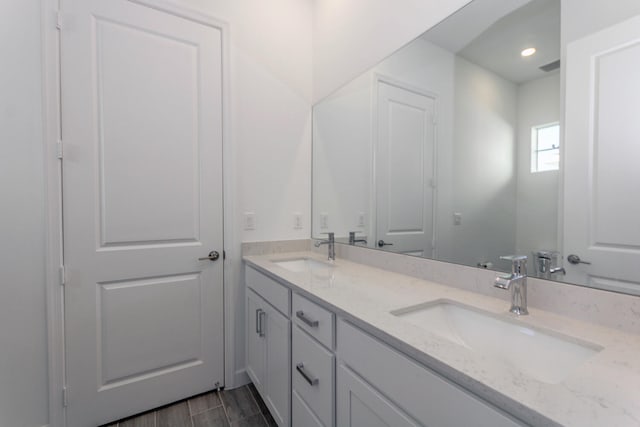 bathroom featuring vanity and hardwood / wood-style flooring