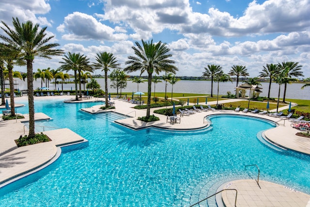 view of pool featuring a water view