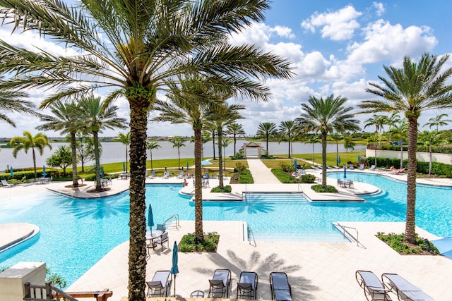 view of swimming pool featuring a patio area