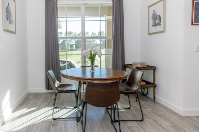 dining area with light hardwood / wood-style flooring