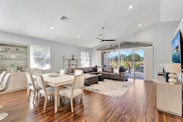 dining space with ceiling fan, plenty of natural light, and lofted ceiling