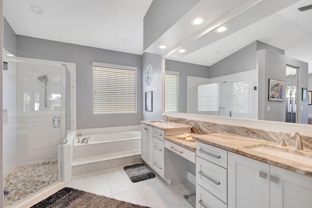 bathroom featuring vanity, plus walk in shower, and vaulted ceiling