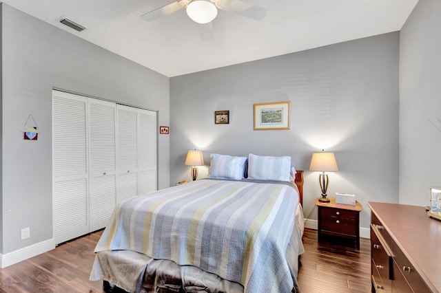 bedroom featuring a closet, ceiling fan, and dark hardwood / wood-style flooring