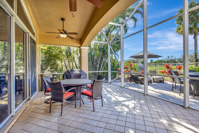 sunroom with ceiling fan and a healthy amount of sunlight