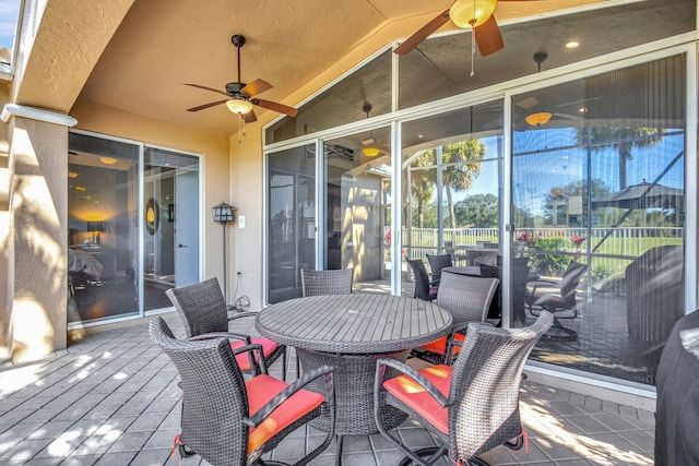 wooden terrace featuring ceiling fan