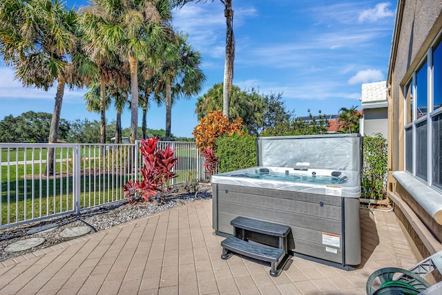 deck featuring a hot tub