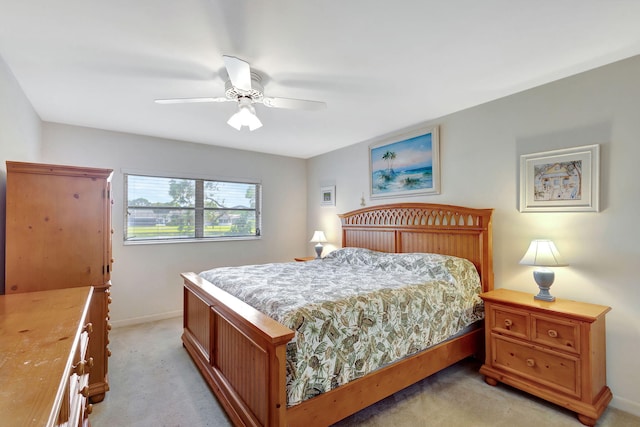 bedroom featuring light carpet and ceiling fan