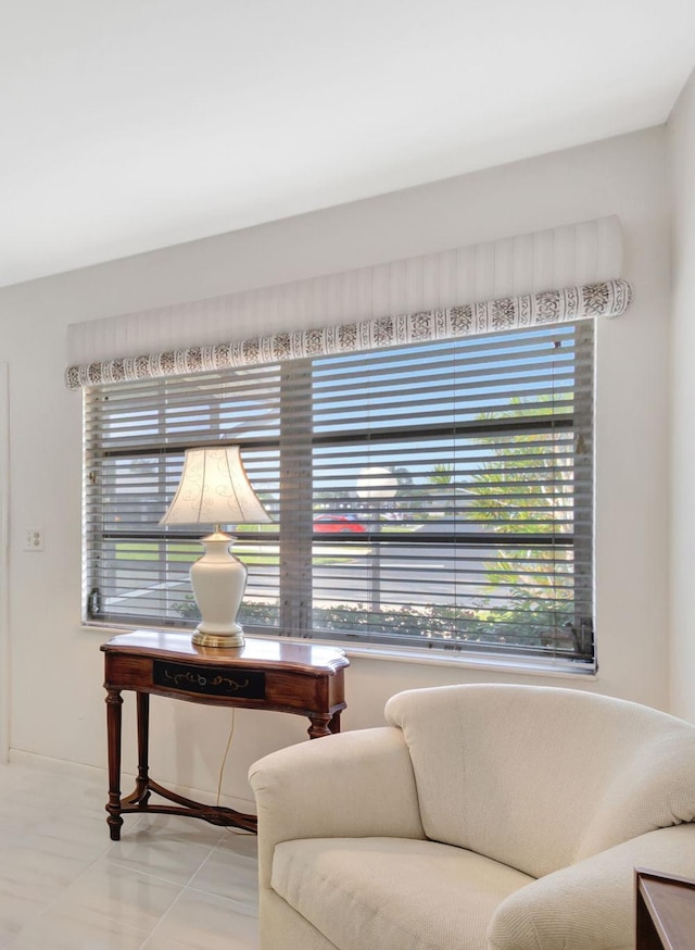 sitting room with light tile patterned floors