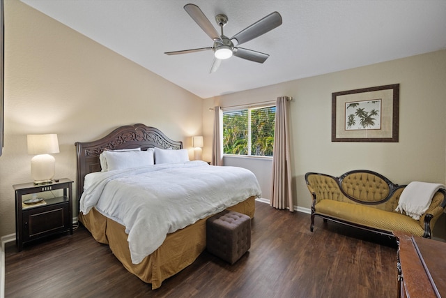 bedroom featuring ceiling fan, baseboards, lofted ceiling, and dark wood finished floors