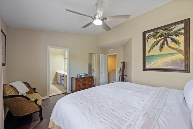 bedroom featuring visible vents, a ceiling fan, dark wood-style floors, connected bathroom, and baseboards
