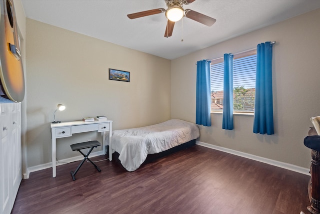 bedroom featuring wood finished floors, baseboards, and ceiling fan