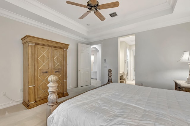 bedroom featuring ceiling fan, crown molding, and light colored carpet