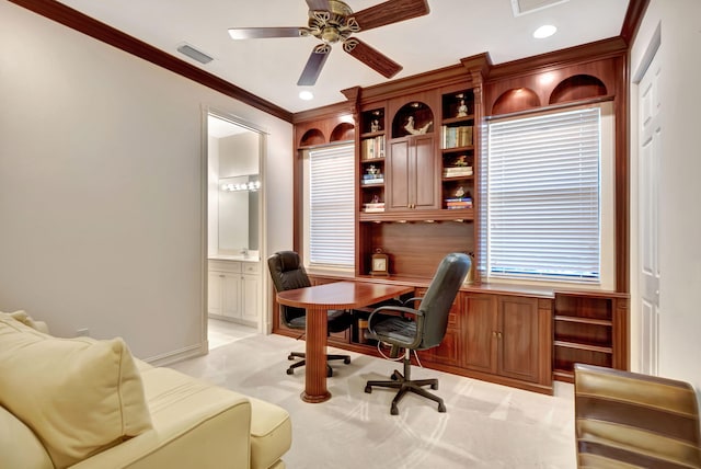 office space with light carpet, ceiling fan, and crown molding