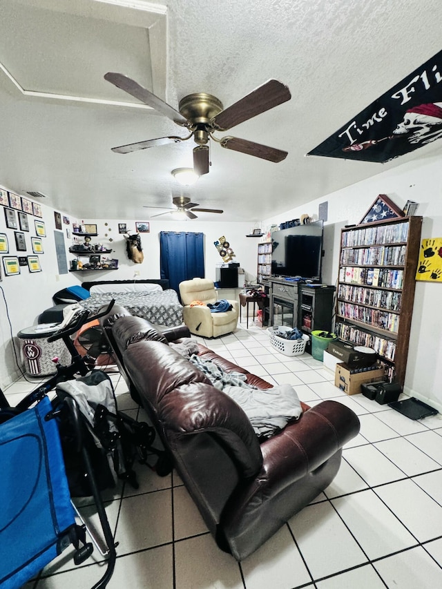 living room with tile patterned flooring and a textured ceiling