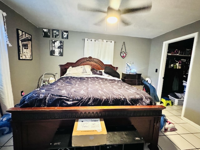 bedroom with ceiling fan and tile patterned flooring