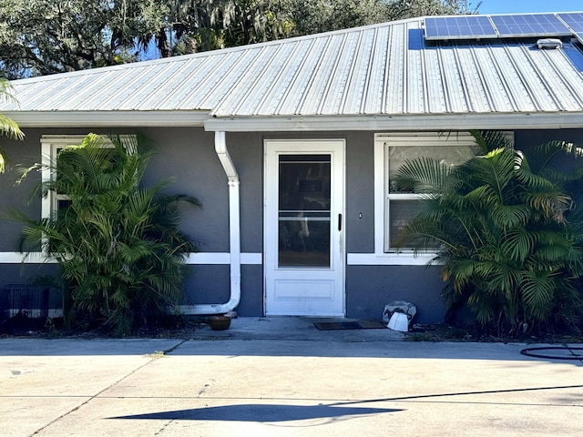 entrance to property featuring solar panels