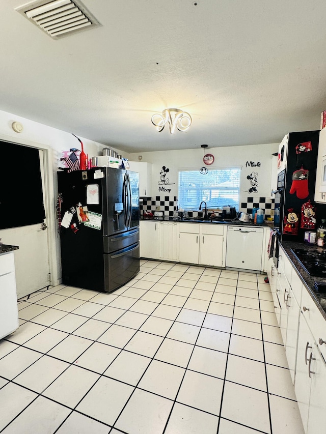 kitchen featuring backsplash, black refrigerator with ice dispenser, sink, dishwasher, and white cabinets