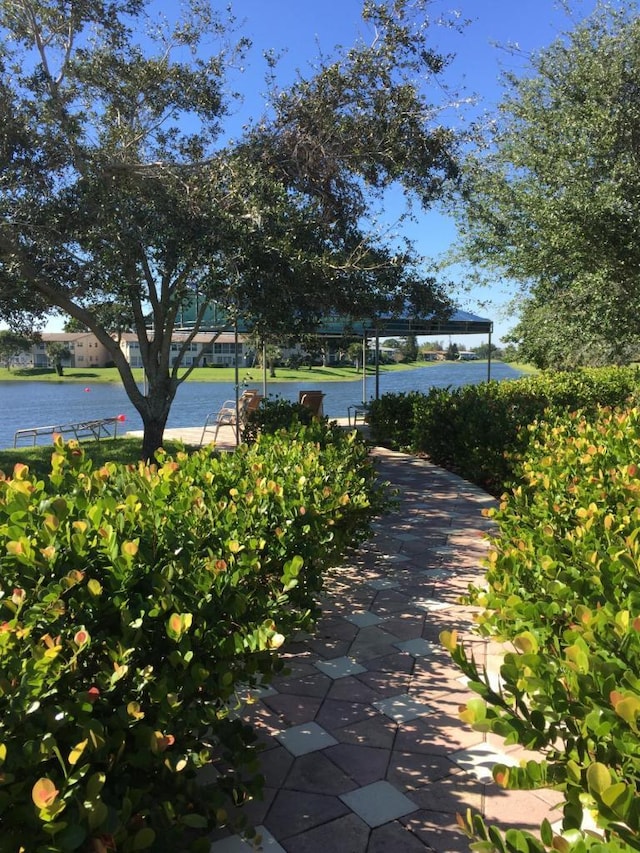 surrounding community featuring a water view