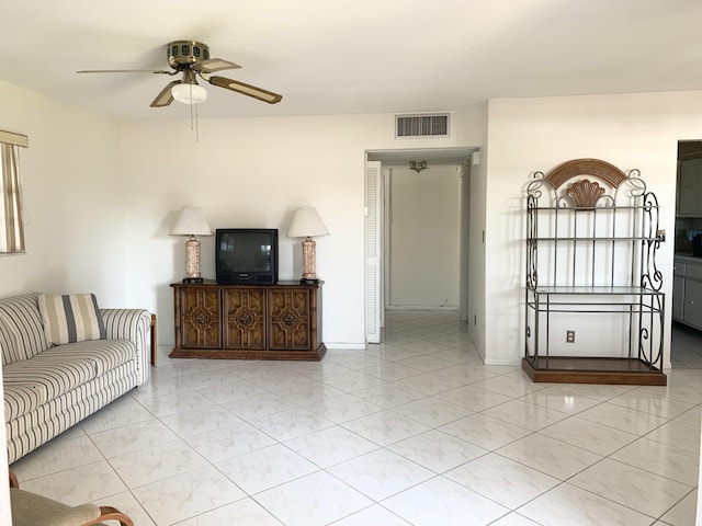 unfurnished living room featuring ceiling fan