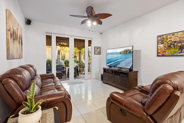 tiled living room featuring french doors and ceiling fan