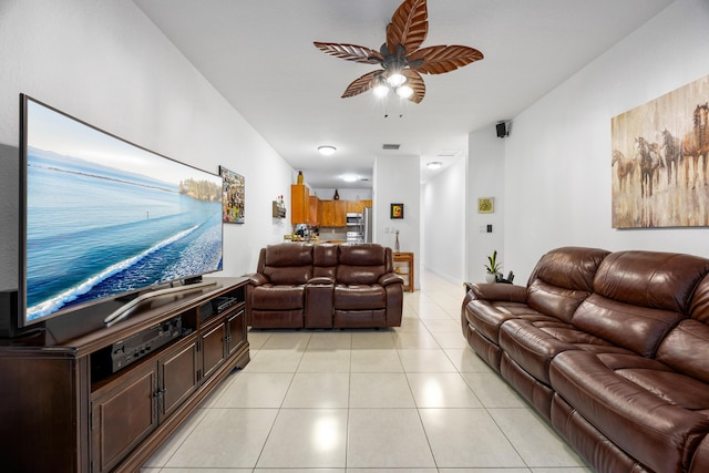 tiled living room featuring ceiling fan