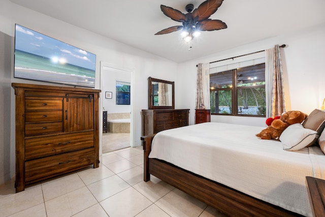 bedroom featuring light tile patterned flooring, connected bathroom, and ceiling fan