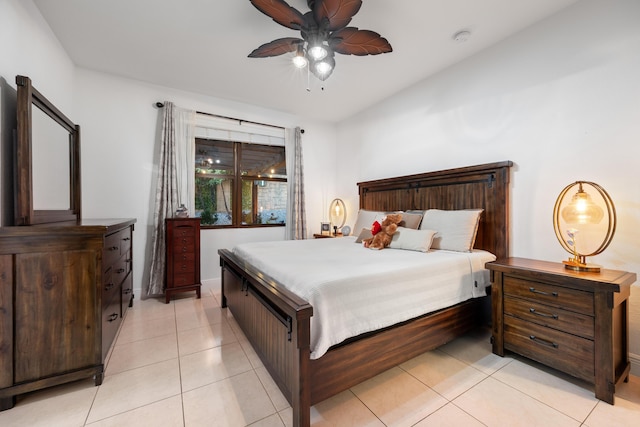 tiled bedroom with ceiling fan