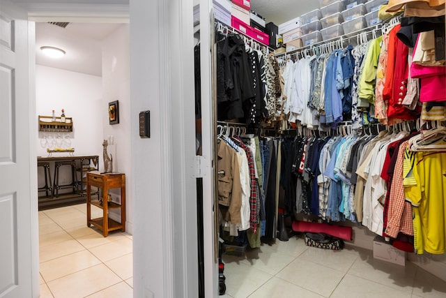 spacious closet with tile patterned flooring