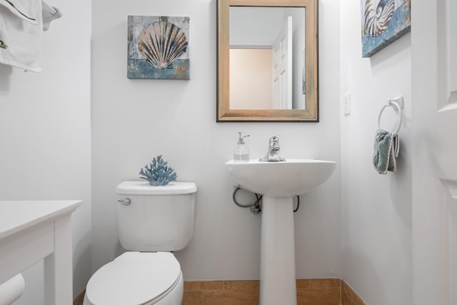 bathroom with tile patterned floors and toilet