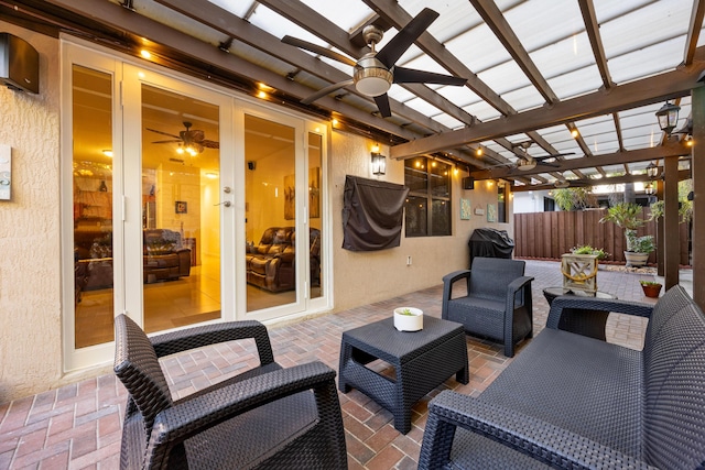 view of patio featuring french doors, grilling area, outdoor lounge area, a pergola, and ceiling fan