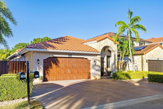 mediterranean / spanish-style house featuring a garage