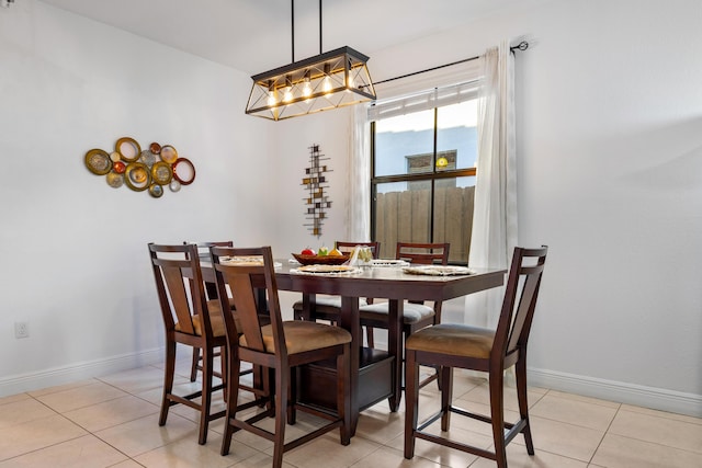 dining area featuring light tile patterned floors