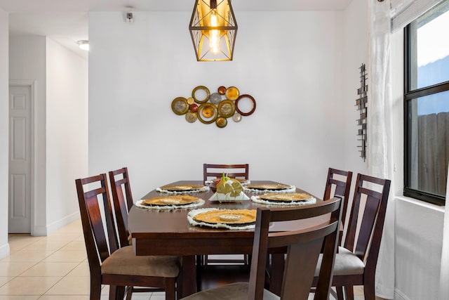 dining space featuring light tile patterned floors