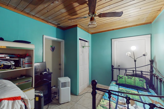 tiled bedroom featuring ceiling fan, crown molding, and wooden ceiling