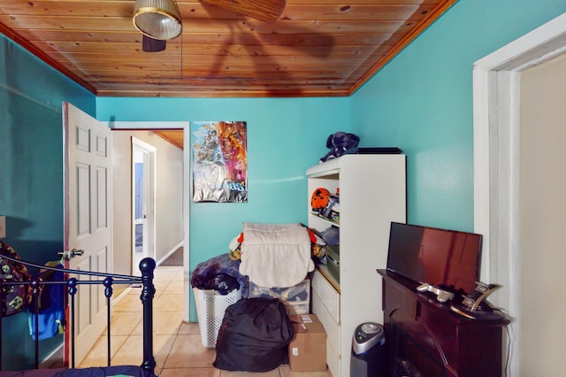 bedroom with ceiling fan, wood ceiling, and light tile patterned floors