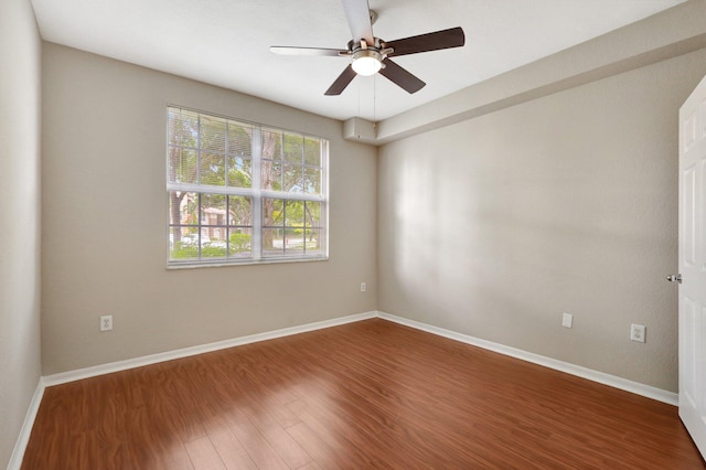 empty room featuring hardwood / wood-style flooring and ceiling fan