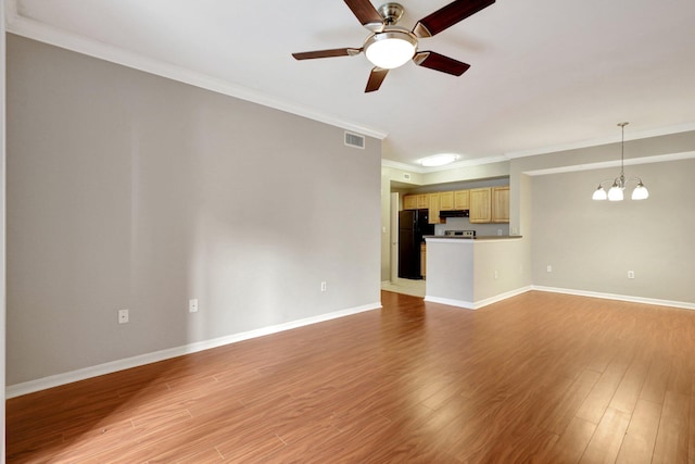 unfurnished living room with ornamental molding, ceiling fan with notable chandelier, and light wood-type flooring