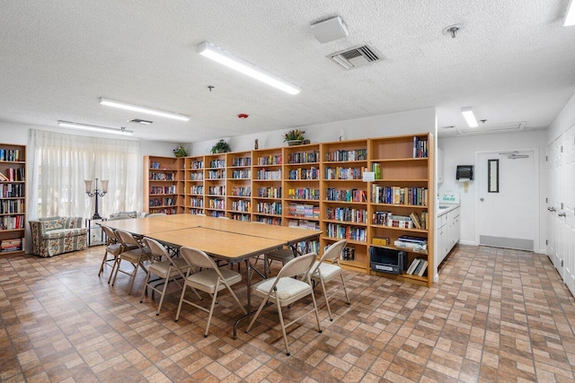 dining area with a textured ceiling