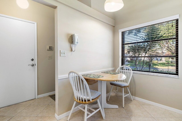 dining room with light tile patterned flooring