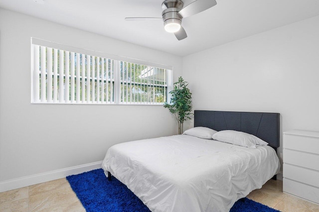 bedroom featuring ceiling fan and light tile patterned floors